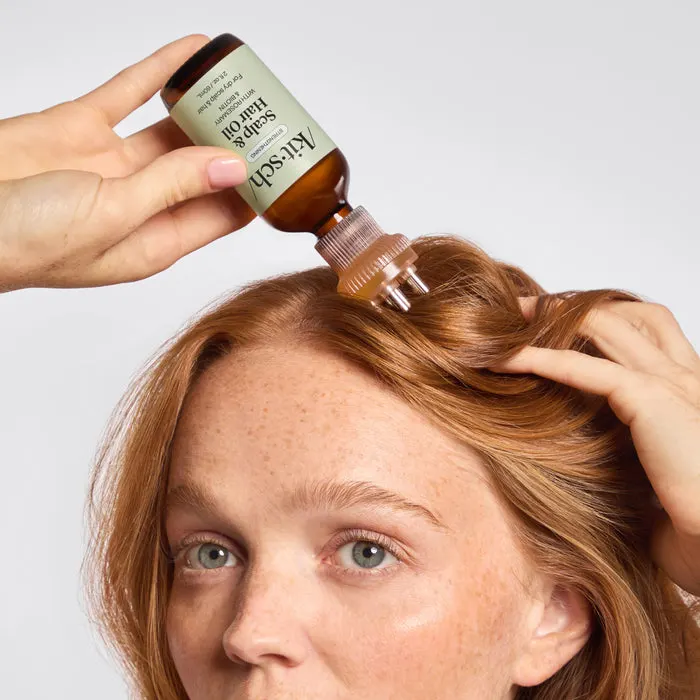 Rosemary and biotin oil applied to the scalp
