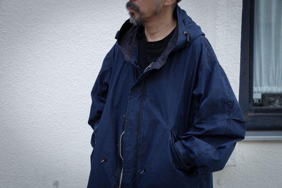 Finsbury Parka worn open over a dark knit