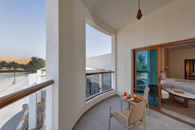 Western Liwa Hotel room with a balcony